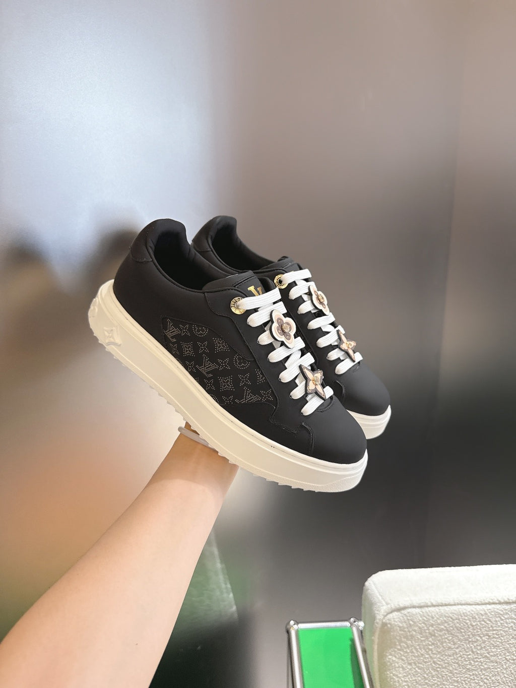 Louis Vuitton low-top sneakers, black monogram leather, white sole and lace accents
