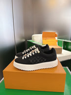 Louis Vuitton low-top sneakers, black monogram print, white sole and laces