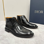 Black leather ankle boots with lace-up front, side zipper, and wingtip detailing