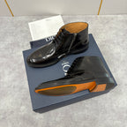 Black leather lace-up ankle boots with side zipper and brogue toe; outsole shown