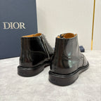 Black leather lace-up ankle boots with side zipper; embossed logo near heel