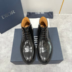 Black leather lace-up dress boots with brogue-style toe detailing, interior lining visible