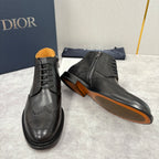 Dior unisex black leather boots with side zip, lace-up front, brogue perforations, low heel