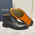 Dior unisex black leather lace-up boots with orange rubber outsole and brogue detailing