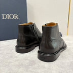 Dior unisex black leather ankle boots with rear seam, brogue detailing, and low profile sole