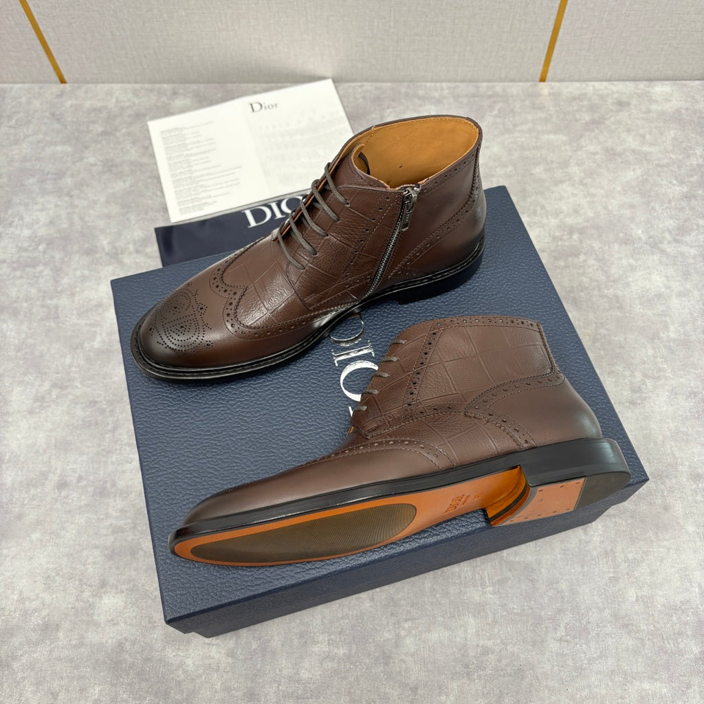 Brown leather ankle boots with side zipper and brogue detailing with dark rubber soles