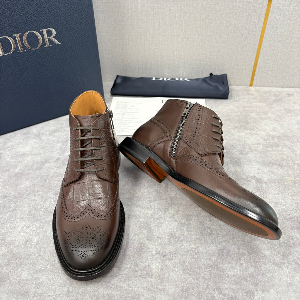 Brown leather lace-up ankle boots with side zip and brogue wingtip details.