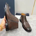 Brown leather ankle boots with perforated brogue, side zipper, and black rubber soles