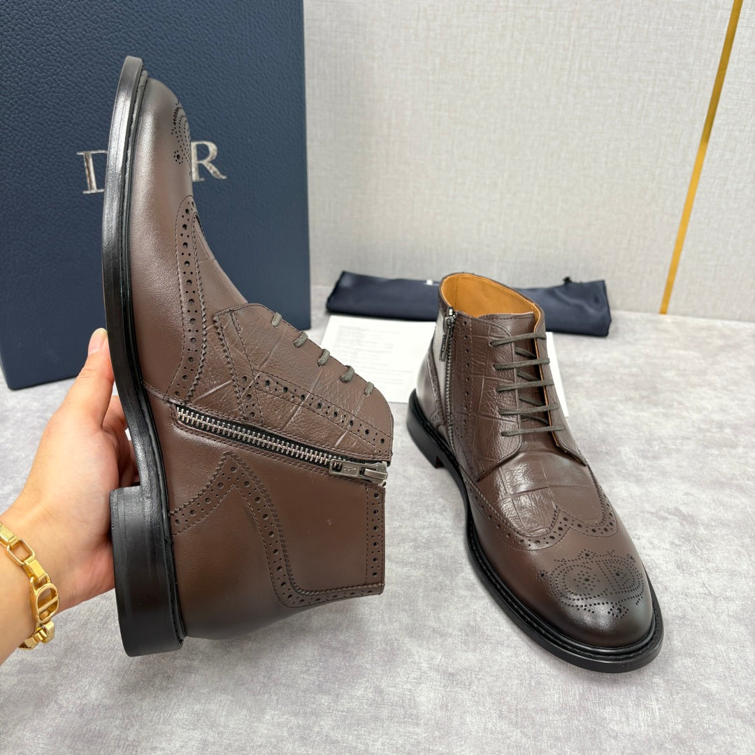 Brown leather ankle boots with perforated brogue, side zipper, and black rubber soles