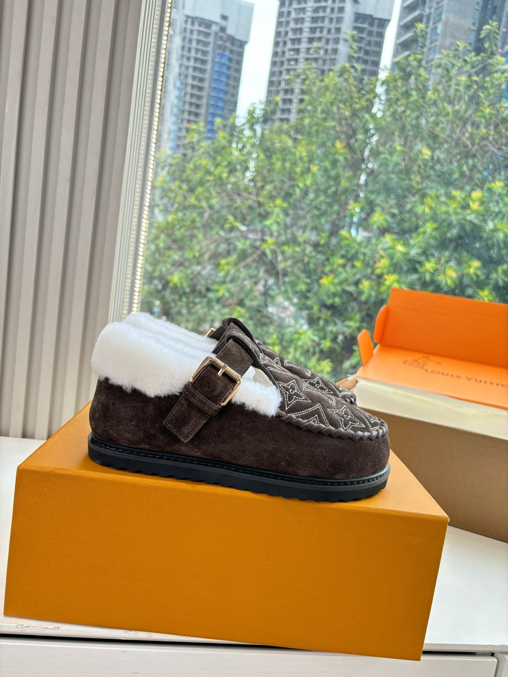 Louis Vuitton suede slippers with monogram pattern, white faux-fur trim, buckle strap