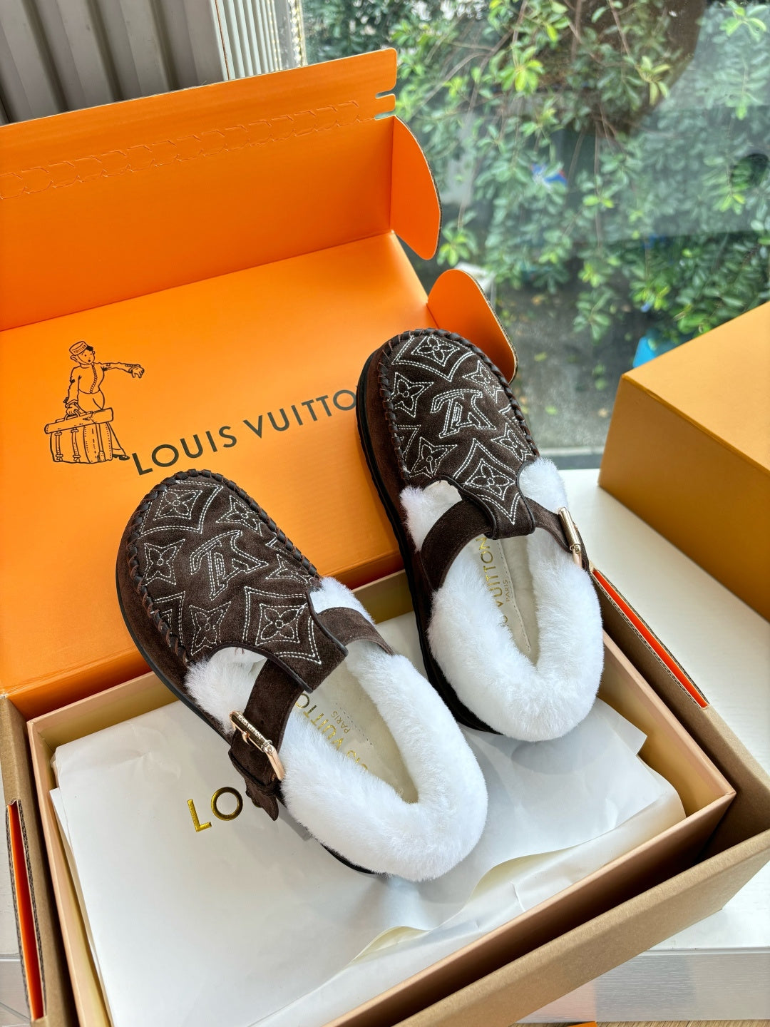 Pair of Louis Vuitton suede slippers with monogram print, white lining, buckle strap