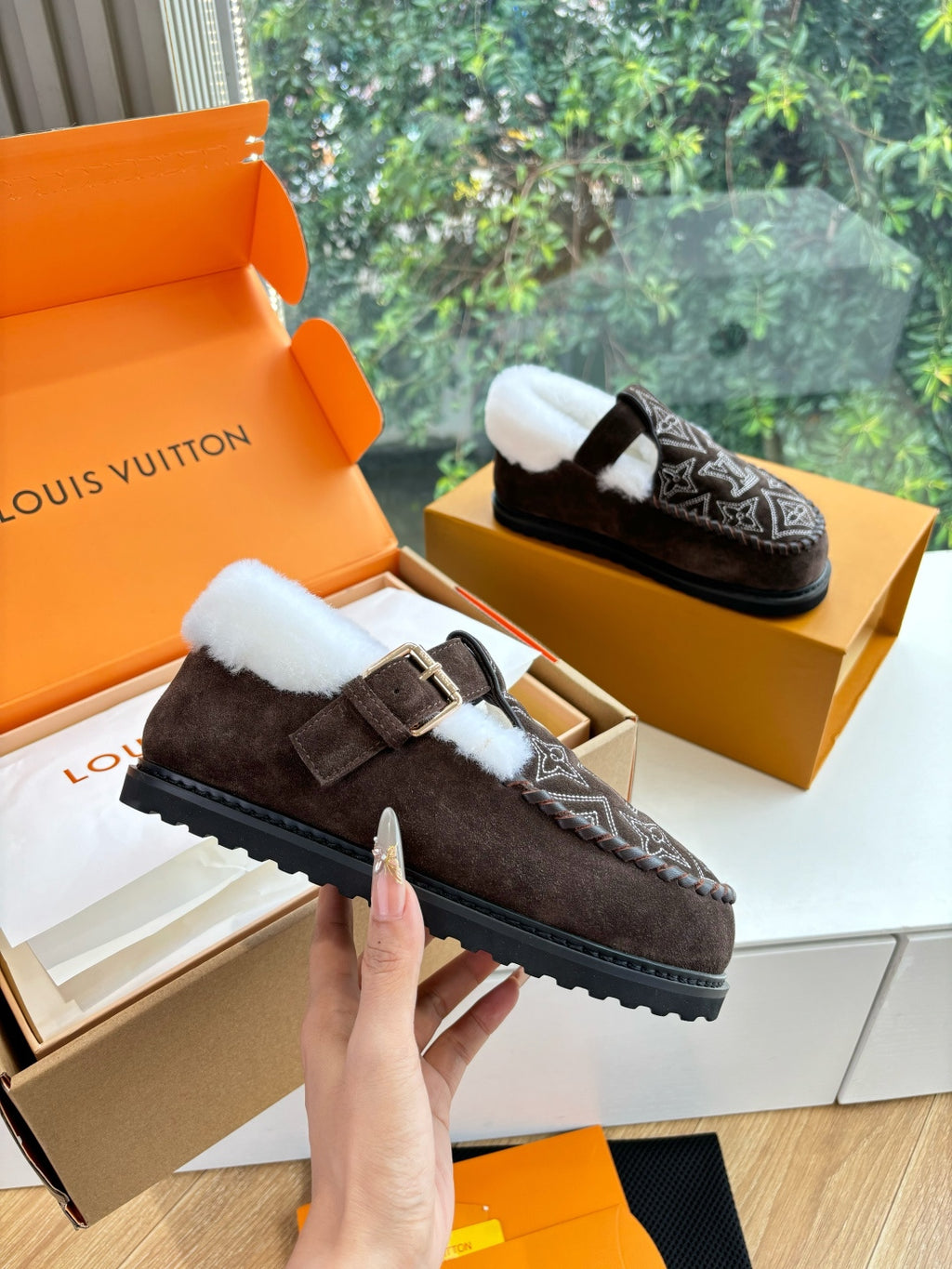 Louis Vuitton suede slipper with monogram pattern, white shearling lining, buckle