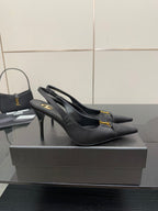 YSL black slingback pumps with stiletto heel and gold logo detail, front angle