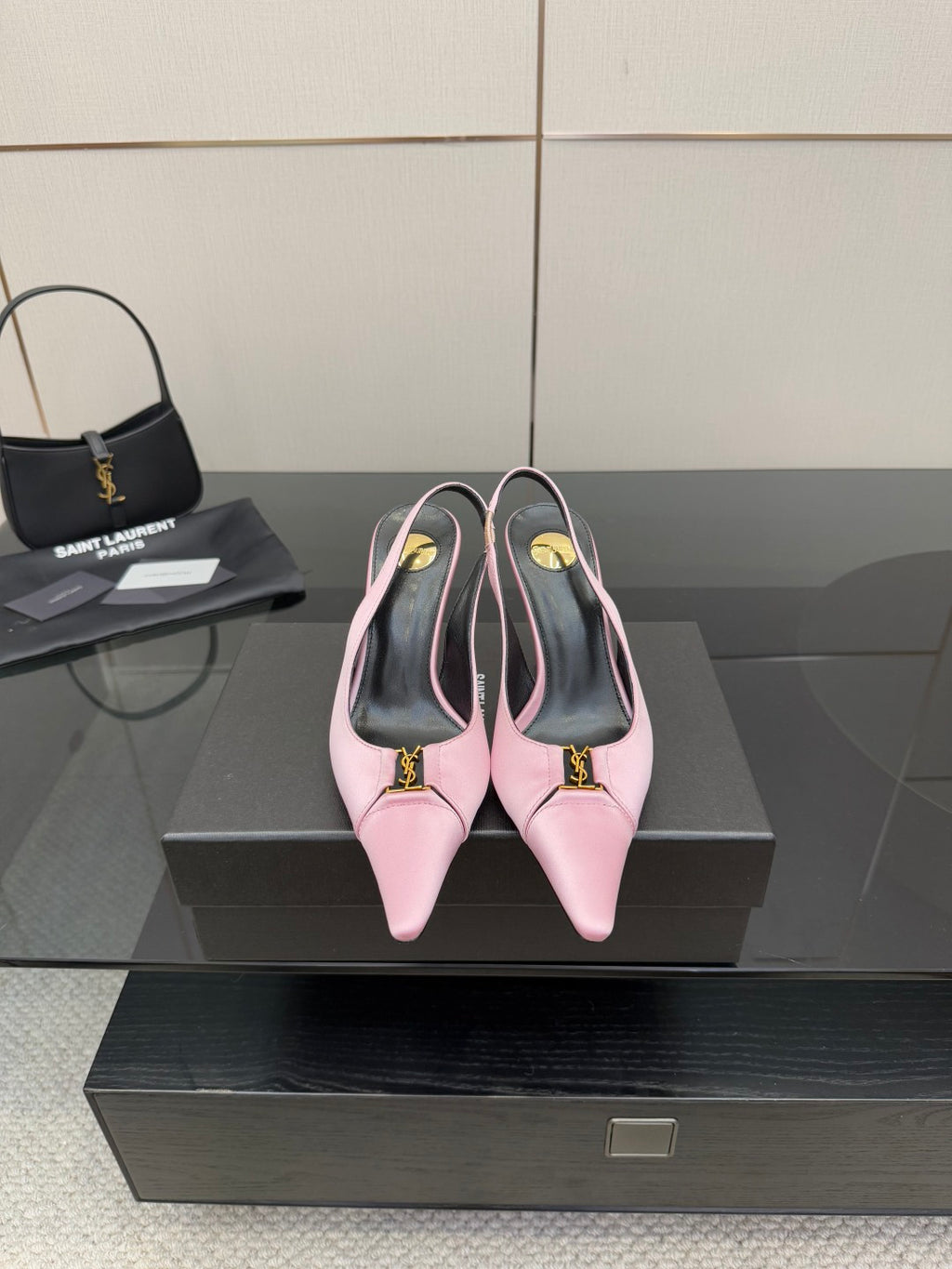 Pink leather pointed-toe slingback heels with high stiletto heel and gold logo detail