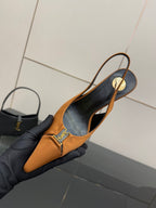Orange slingback heel with gold logo strap and black interior lining