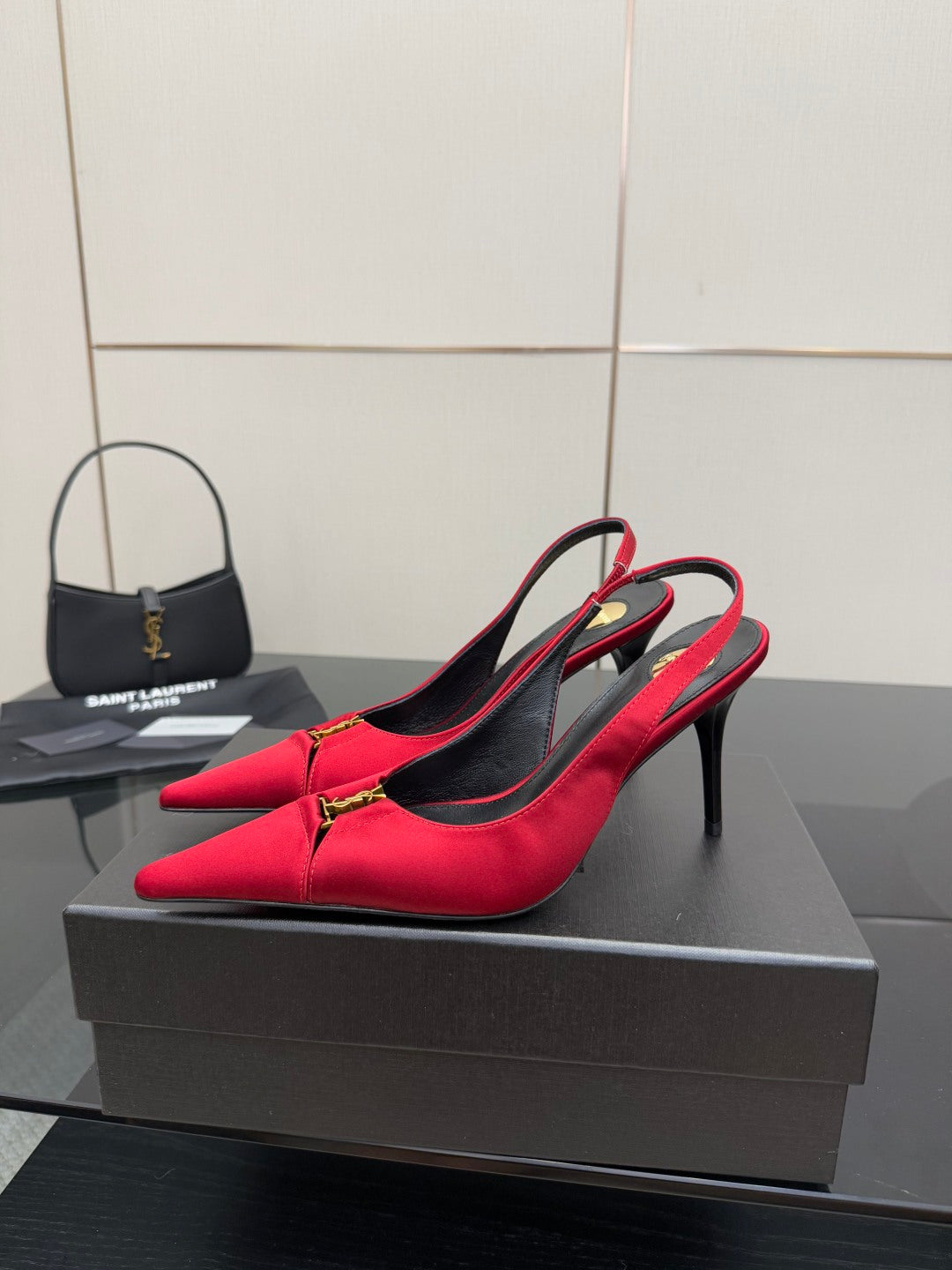 Women’s red pointed-toe slingback pumps on slender black heel