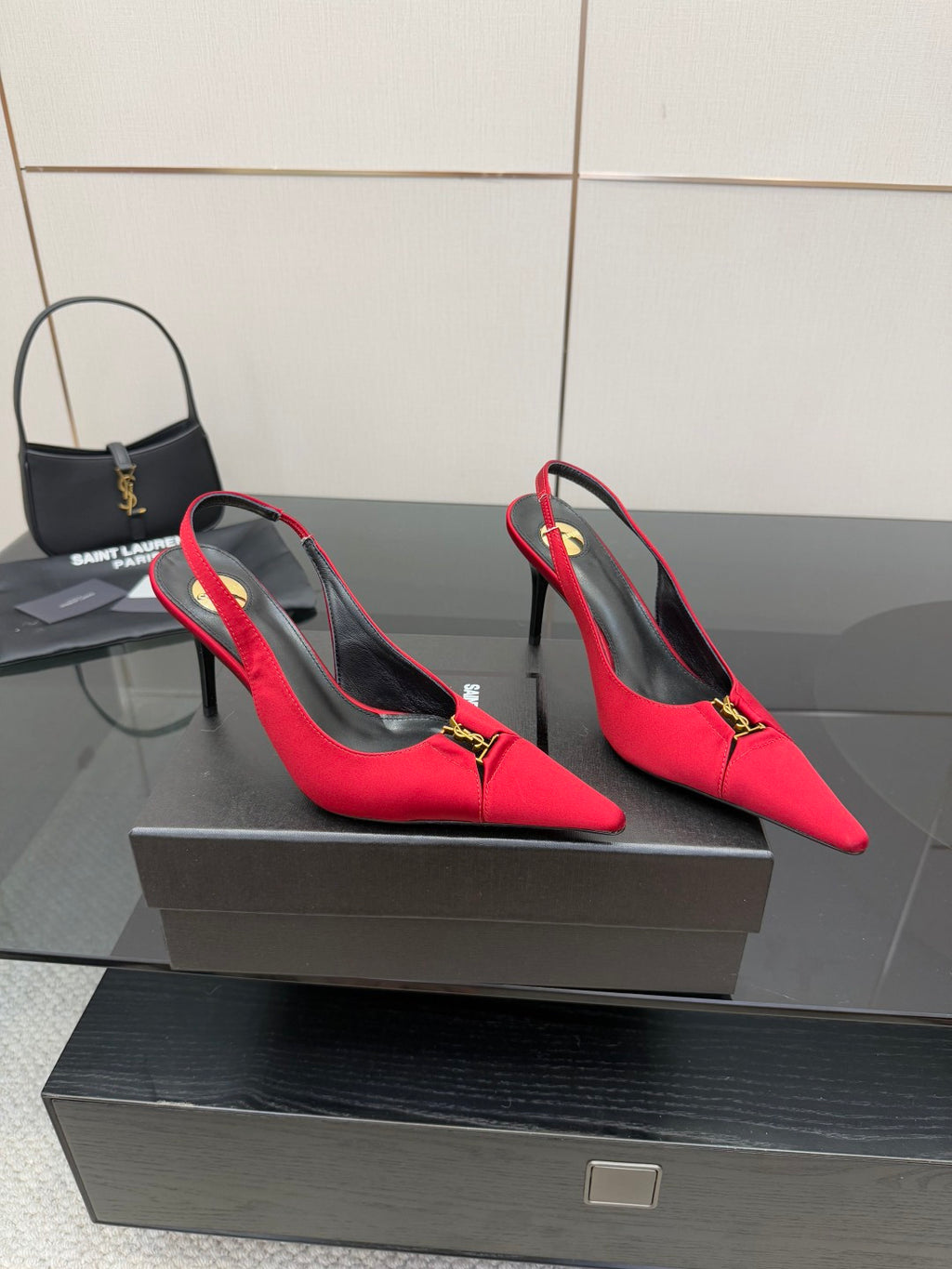 Women’s red slingback heels with YSL gold logo at the vamp