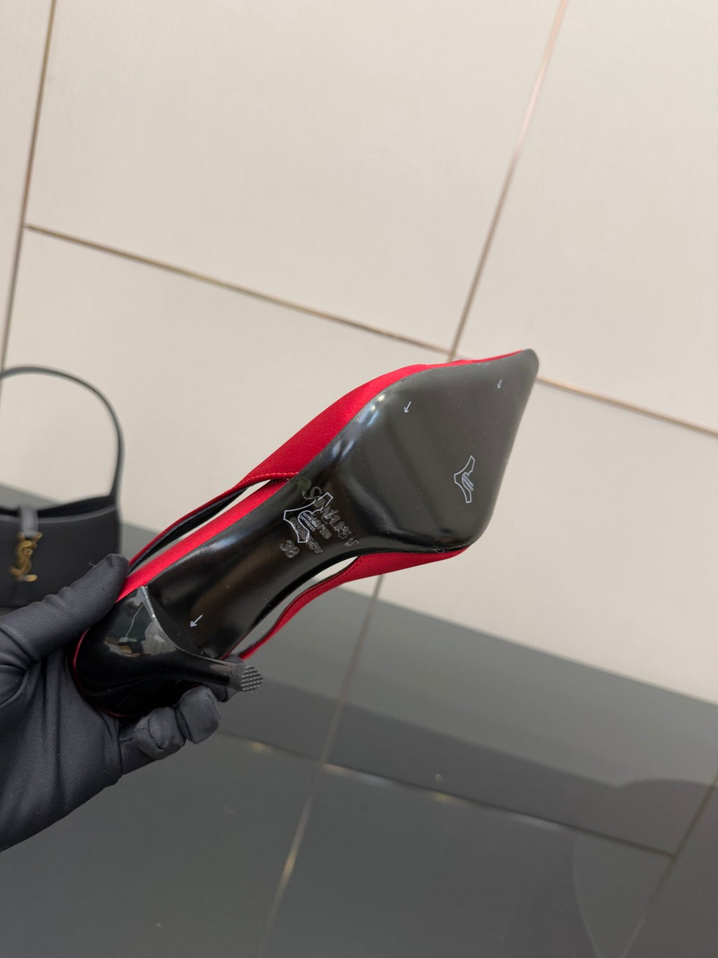 Women’s red slingback heel with black outsole and YSL branding