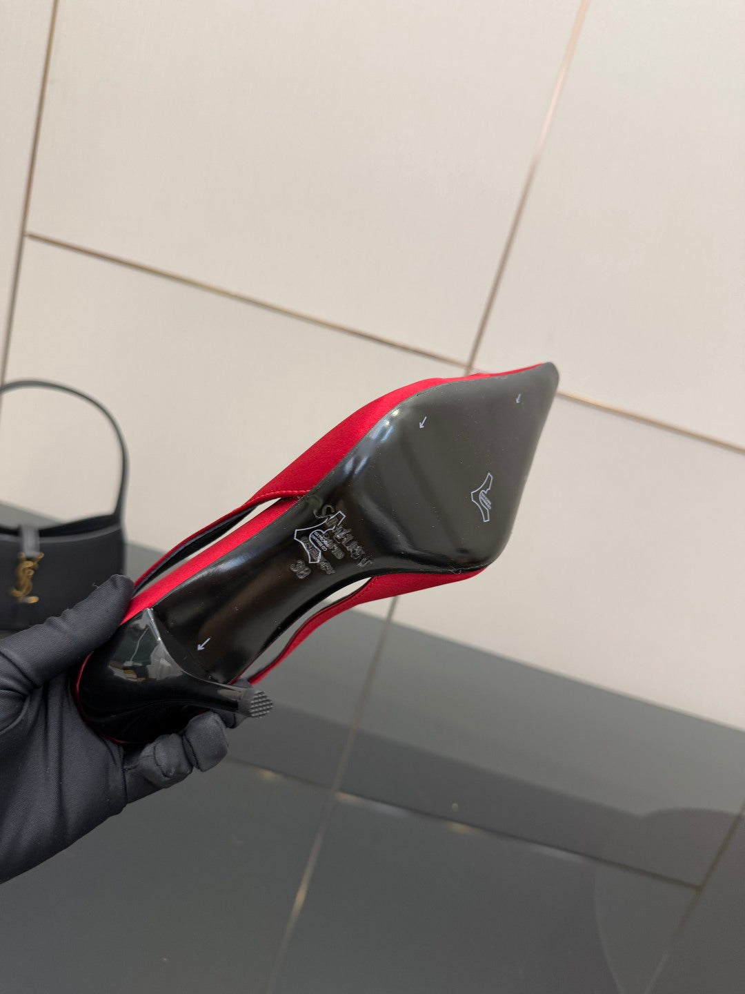 Women’s red slingback heel with black outsole and YSL branding