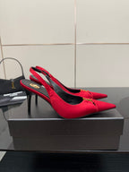 Women’s red slingback heels with black lining and YSL logo detail