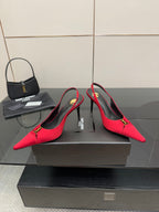 Women’s red pointed-toe slingback heels with YSL gold-tone emblem