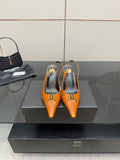 Women's orange pointed-toe stiletto heels with gold buckle detail