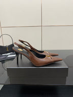 YSL ladies pointed-toe slingback heels, brown with black lining, angled view