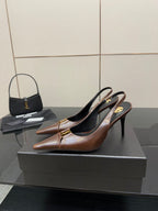 YSL ladies pointed-toe slingback heels, brown uppers with gold hardware, side view
