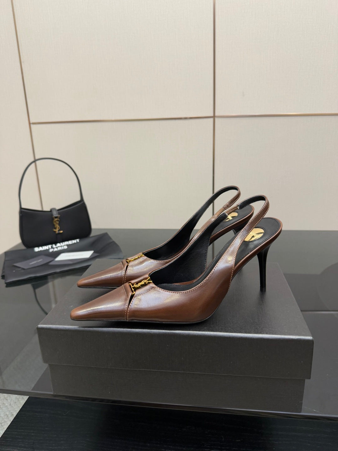 YSL ladies pointed-toe slingback heels, brown uppers with gold hardware, side view