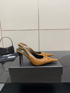 YSL ladies' tan pointed-toe high heels, angled side view with thin stiletto heel