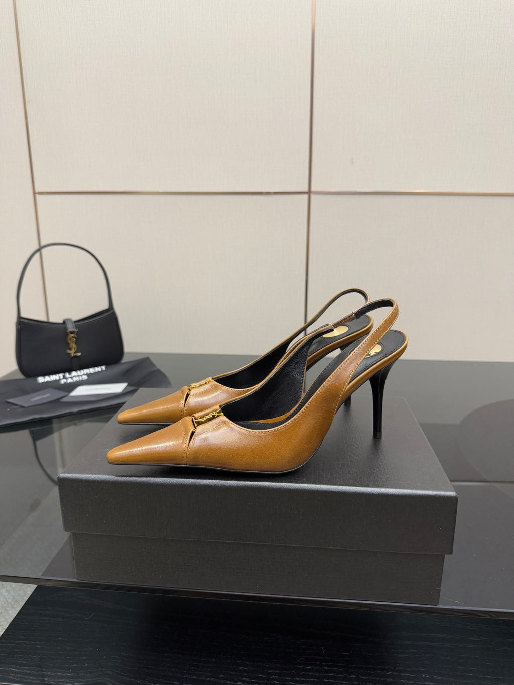 YSL ladies' tan pointed-toe high heel shoes, side view with thin stiletto heel
