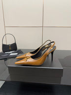 YSL ladies' tan pointed-toe high heel shoes, side view with thin stiletto heel
