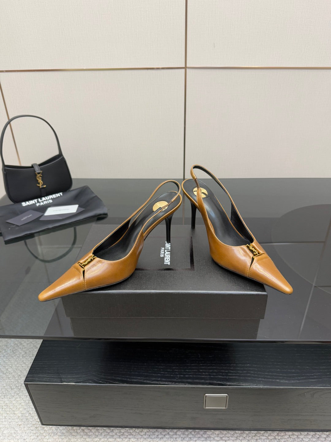 YSL ladies' tan pointed-toe high heels, front 3/4 view with slingback strap