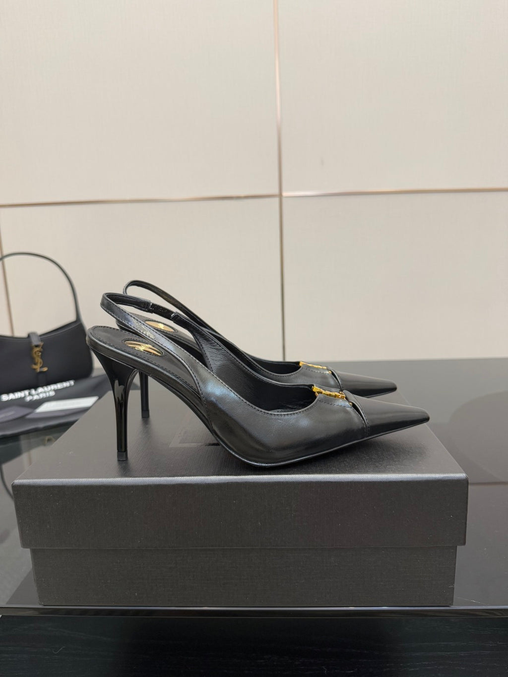 YSL ladies black pointed-toe high heels with gold logo trim and slingback