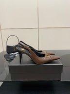 Brown leather pointed-toe slingback pump with slim high heel and gold trim