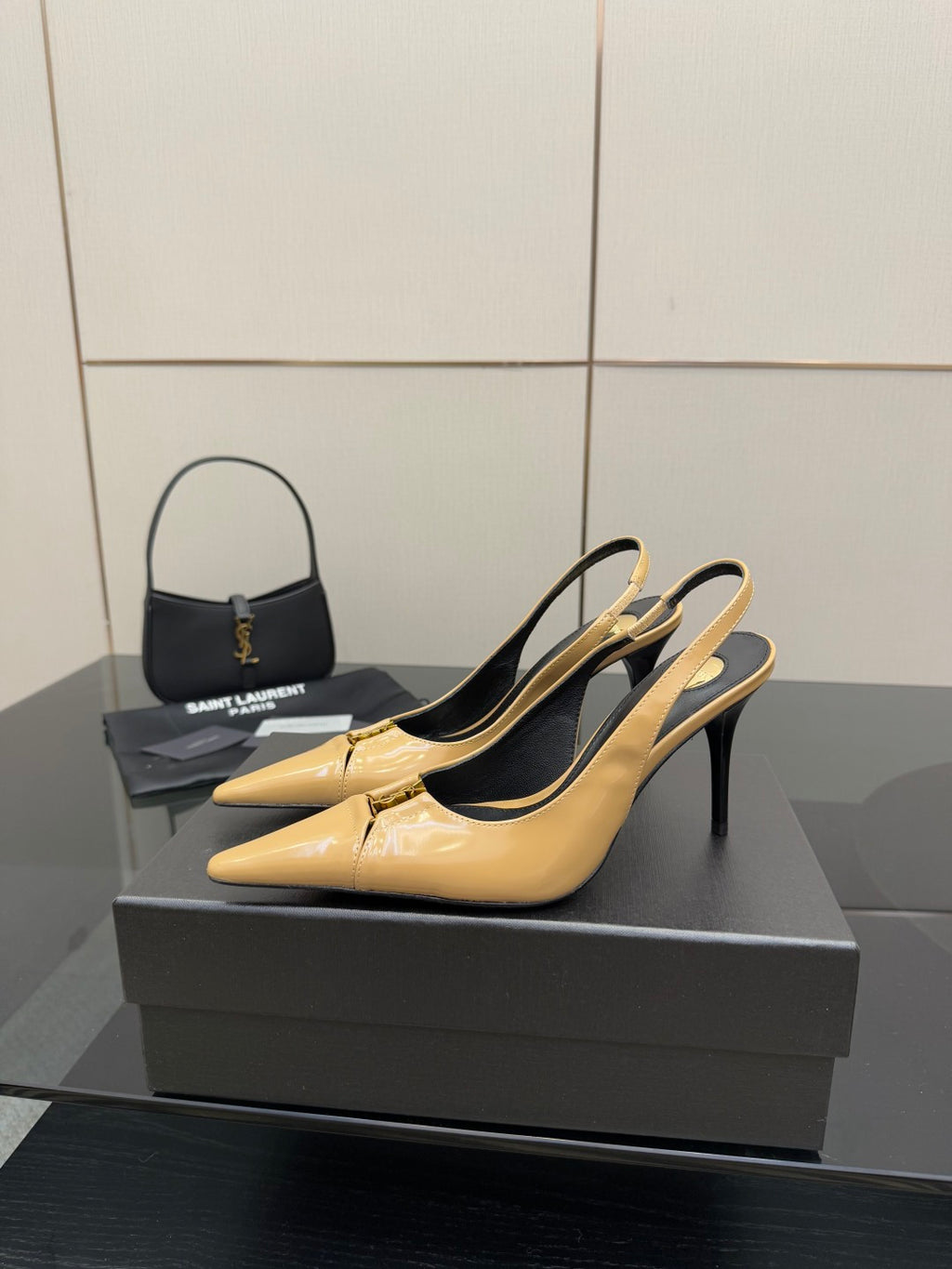YSL beige patent slingback pump with pointed toe and black lining, side view