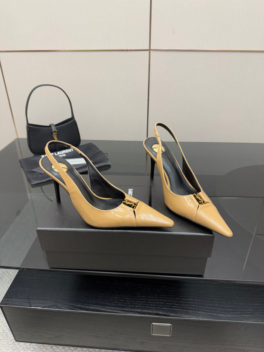 YSL beige patent slingback heels, pointed toe and stiletto heel, angled view