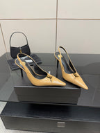 YSL beige patent slingback heels, pointed toe and stiletto heel, angled view