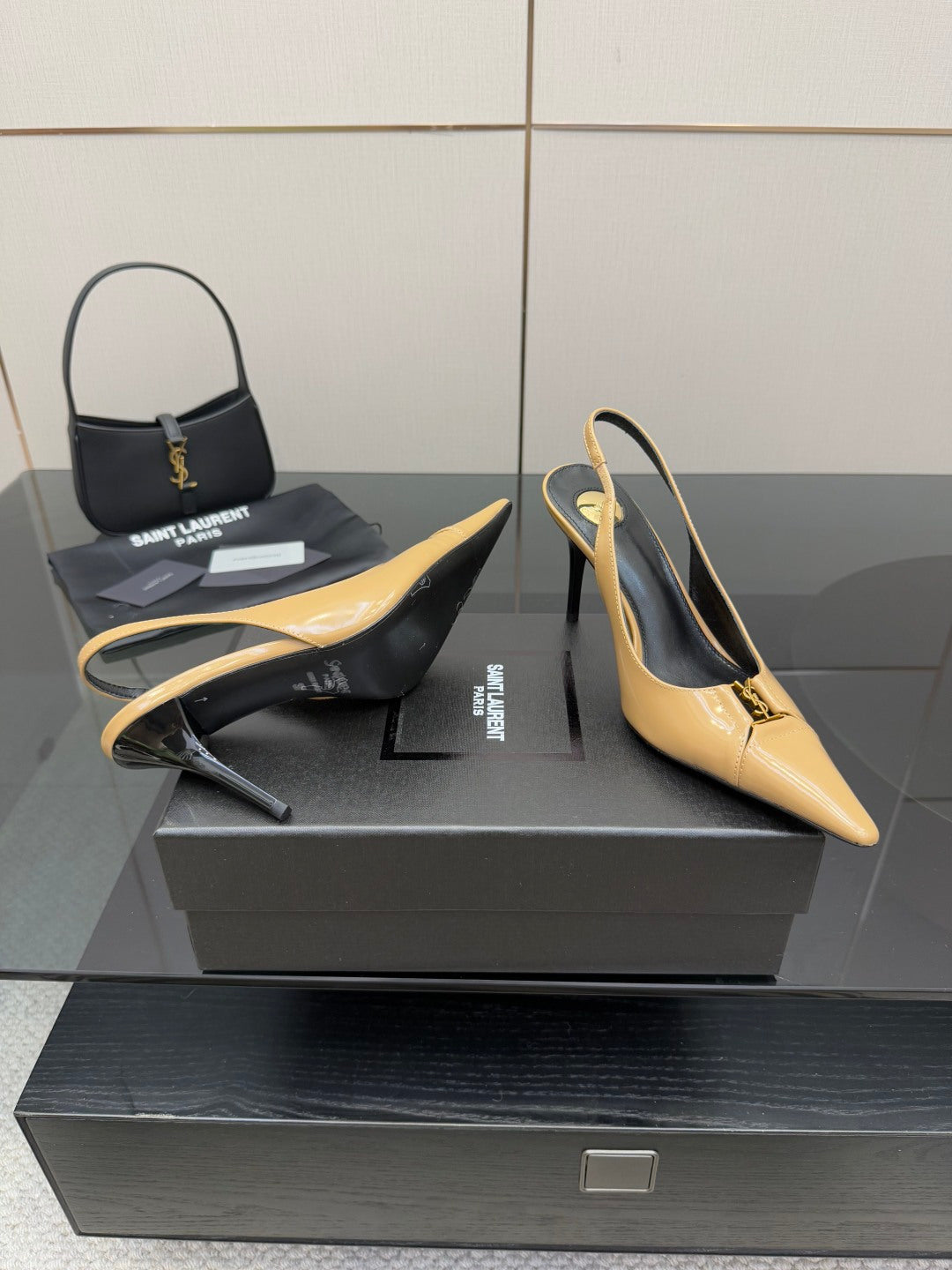 YSL beige patent slingback heels with pointed toe and thin stiletto heel, rear angle