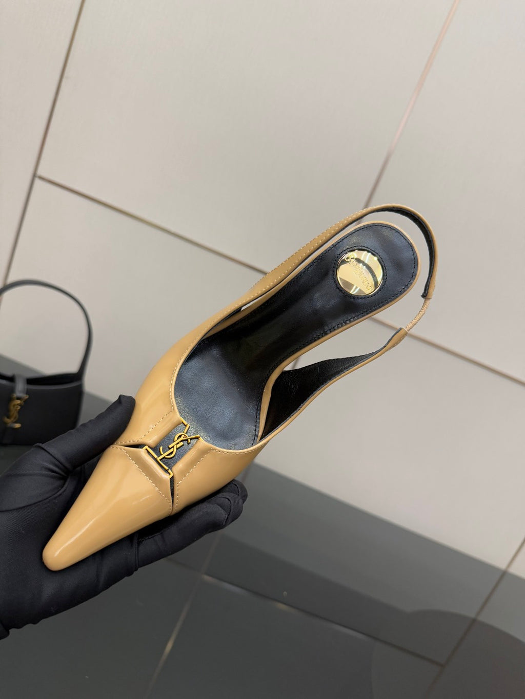 YSL beige patent slingback heel, insole view with YSL logo inside