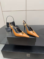 Women’s orange pointed-toe slingback pumps with stiletto heels, showing side profile