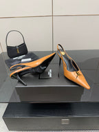 Women’s orange pointed-toe slingback pumps with stiletto heel and black lining