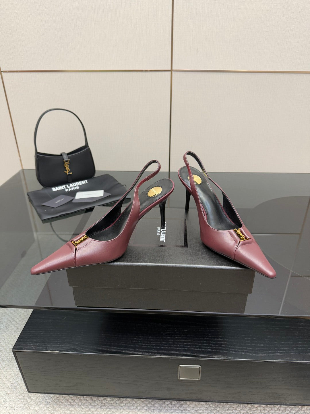 Burgundy women’s slingback pointed-toe heels with slim high heel and gold logo