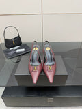 Burgundy women’s pointed-toe slingback heels with gold logo detail