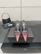 Burgundy women’s pointed-toe slingback heels with gold logo detail