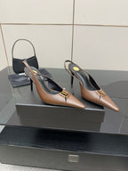Pair of brown pointed-toe slingback pumps with gold-tone logo detail