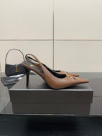 Brown pointed-toe slingback pump on its side profile, high heel visible