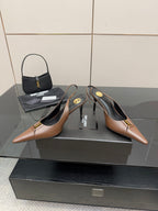 Brown pointed-toe slingback pumps with high heels and gold-tone hardware