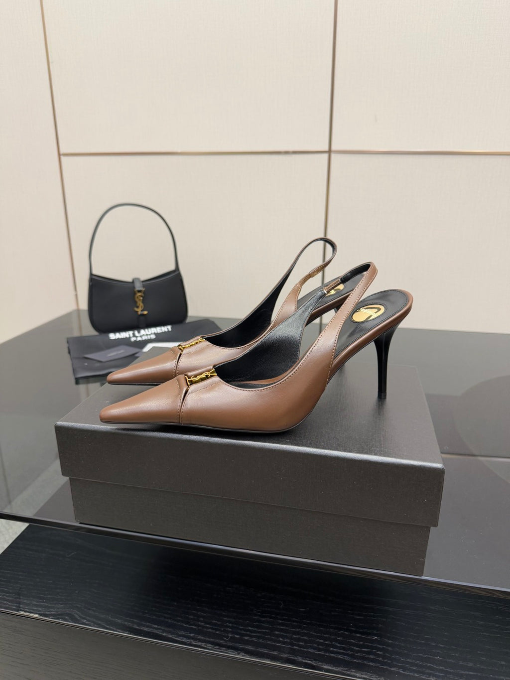 Brown slingback high-heel pumps, pointed toe and black insole visible