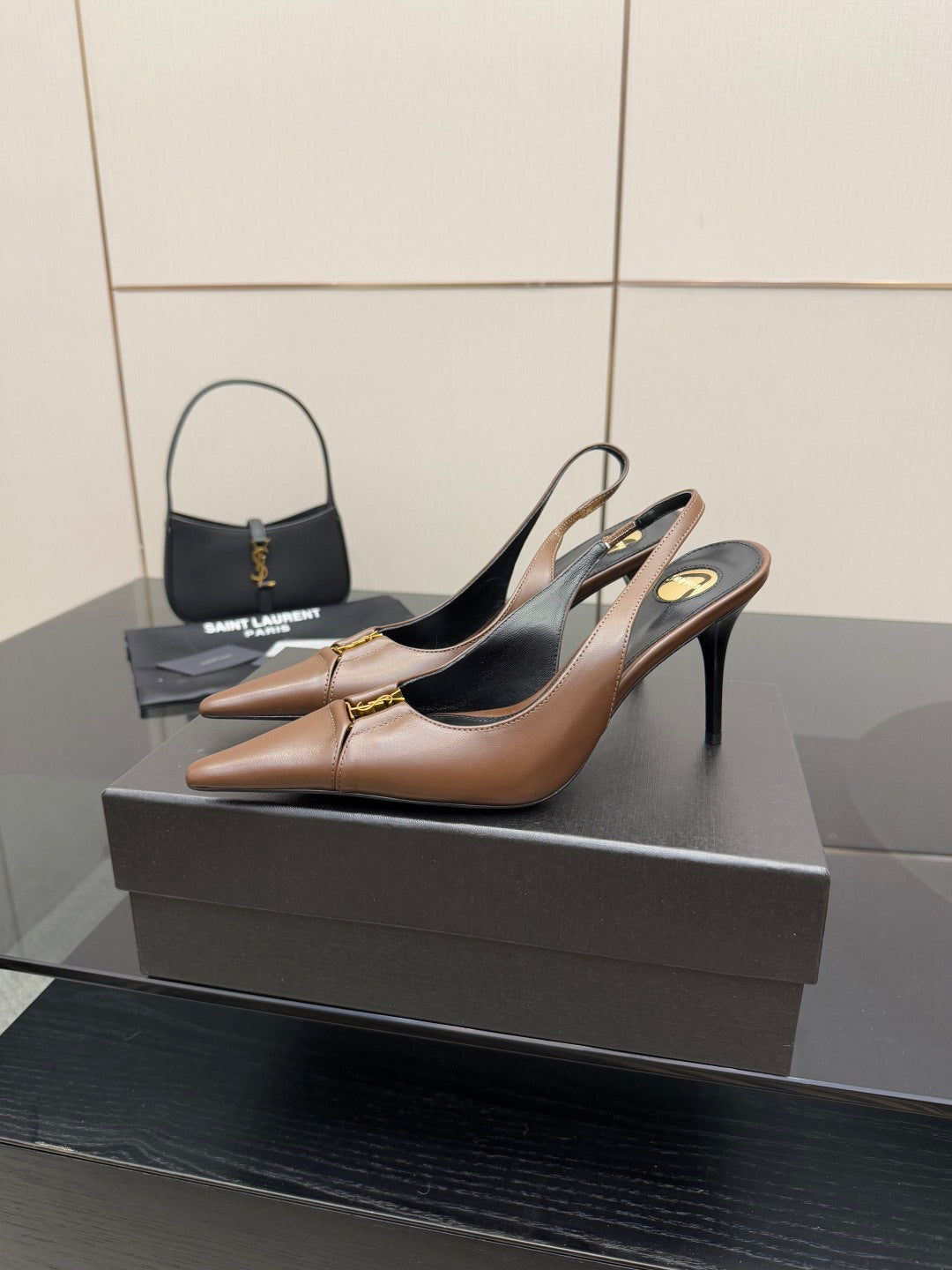 Brown slingback high-heel pumps, pointed toe and black insole visible